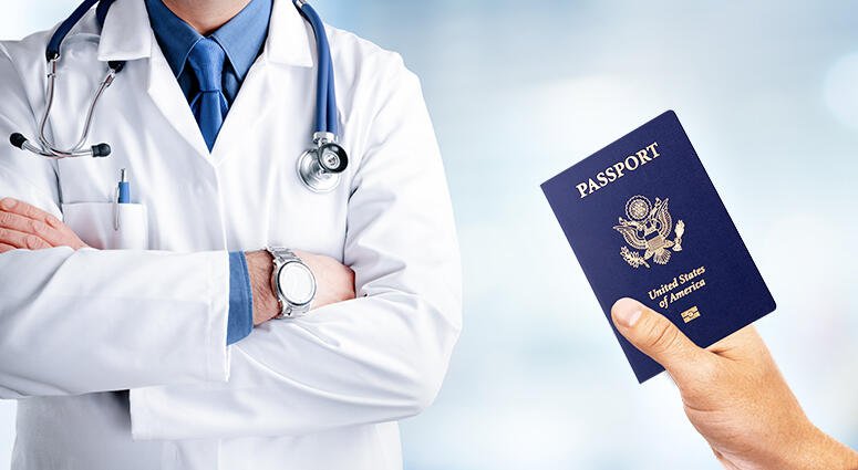 Civil surgeon in a white coat and a hand holding a United States passport