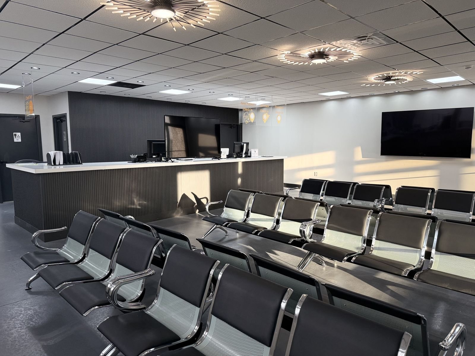 Waiting room with seating and check-in counter